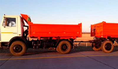 MAZ 555102 (tip-truck) with a trailer